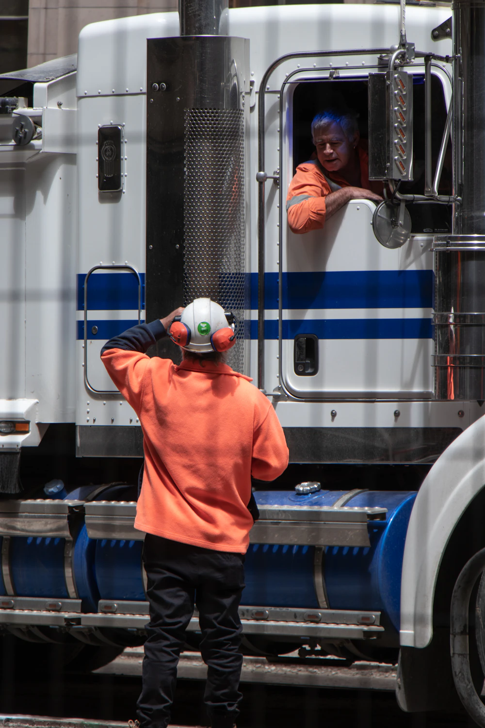 Driver checking his truck before departure