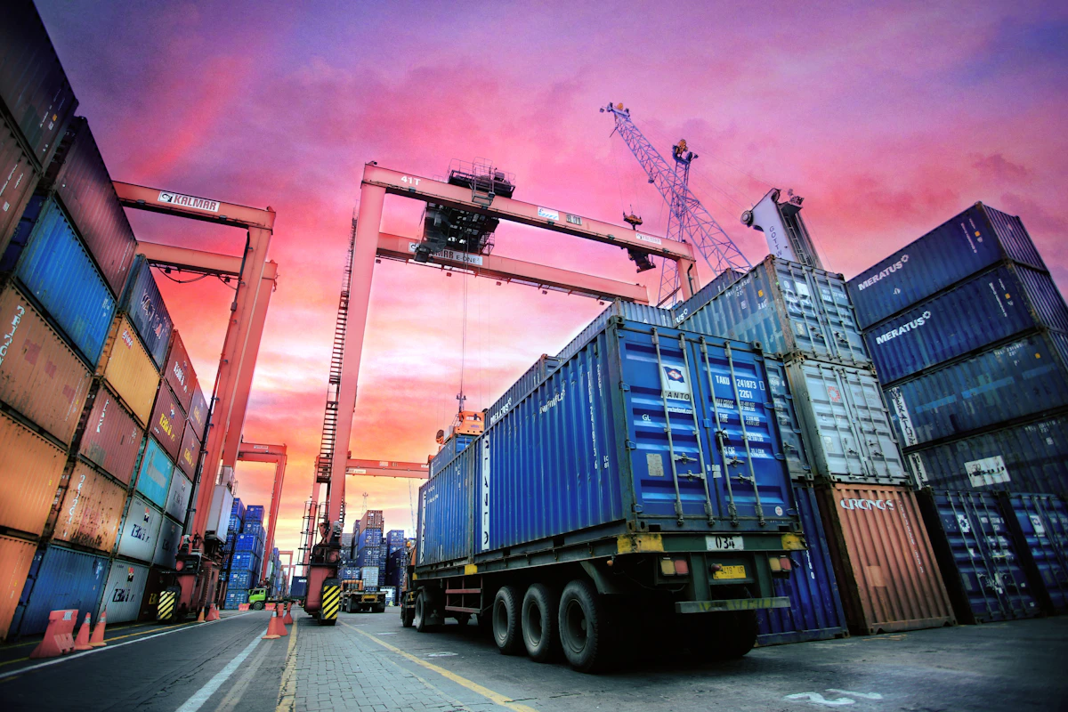 Container truck at a port at sunset