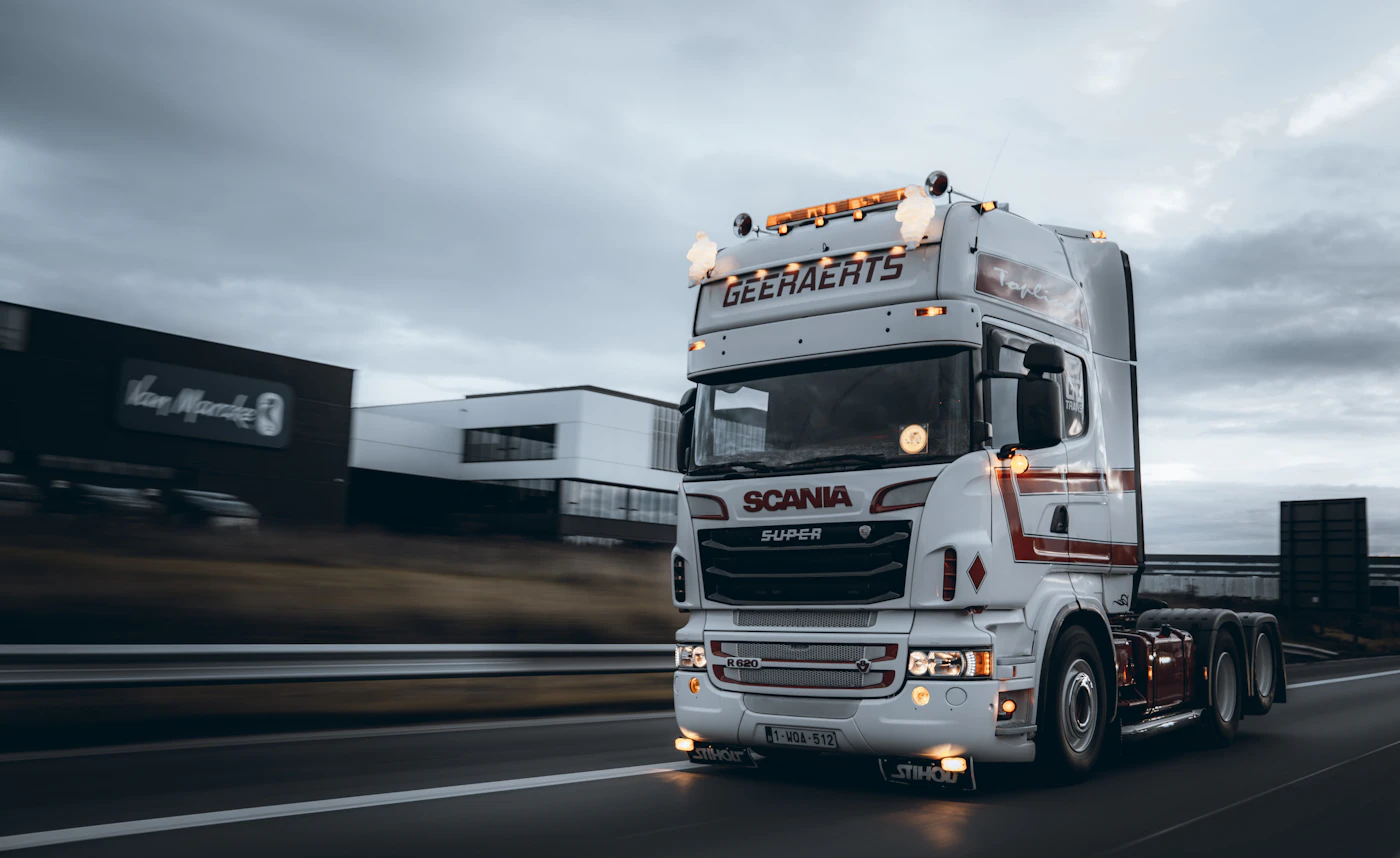 White European truck with trailer on the road